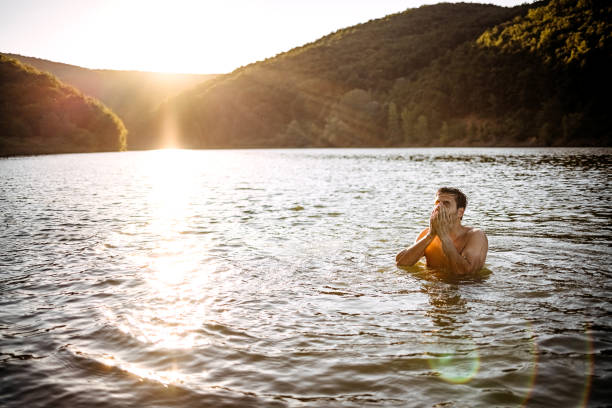 istock Man enjoying mountain lake 1403821922