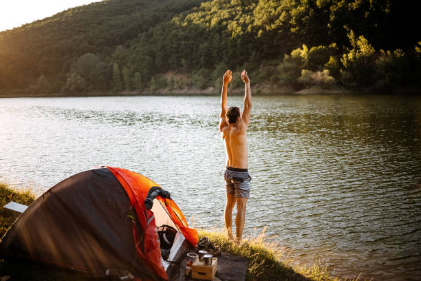 istock Man jumped joyfully into the lake 1403821925