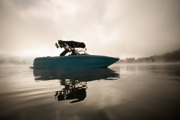 istock side view of bright blue motorboat floating on the water 1403825155
