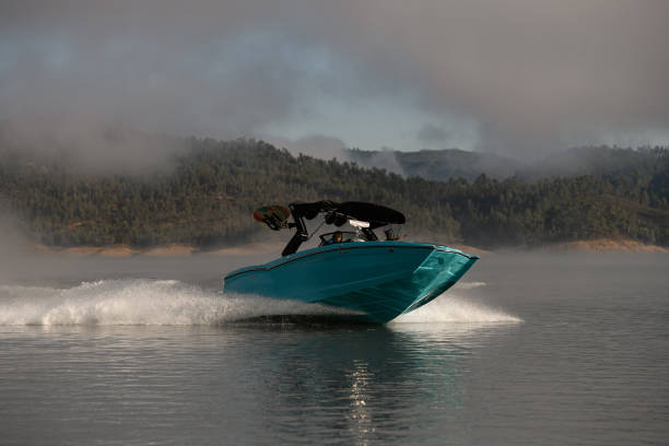 istock beautiful bright blue motorboat quickly floating on the water 1403825356