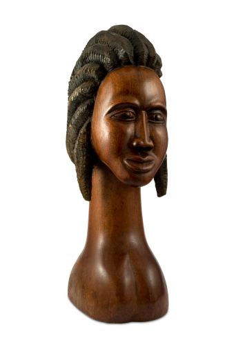 Island Black woman hand carved by local, on white with clipping path. 