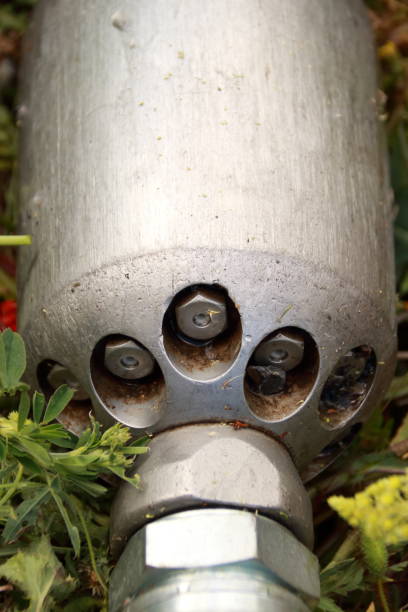 istock Nozzle for cleaning ducts on a meadow 1403828350