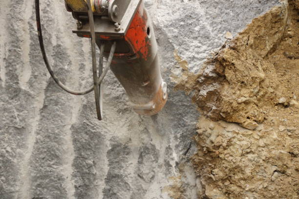 istock Demolition of a house wall with a large chisel 1403829131