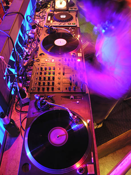 istock A blurred purple DJ working on his turntables 140383149
