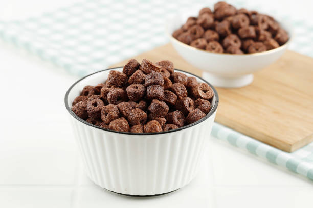 istock Heap of Chocolate Ring Cereal on White Bowl, Breakfast Concept 1403832808