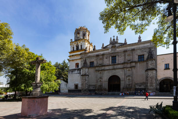Facade of Parroquia San Juan Bautista in Coyoacán, Mexico City, CDMX, Mexico stock photo