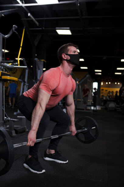 istock Ripped male bodybuilder training at gym 1403832925