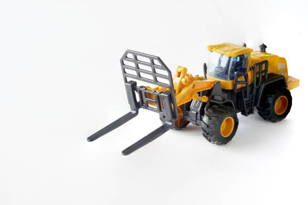 istock Toy off-road forklift to handle large loads, logs and containers. White background. Copy space for an inscription 1403833139