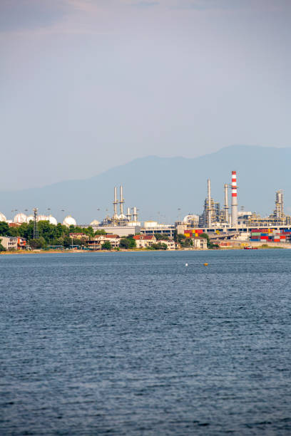 istock Cargo container ship loading on commercial dock in scenic view of industrial area 1403833496