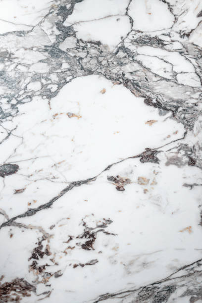 istock White marble stone texture top view. abstract pattern with grey and brown streaks for background or design art 1403834760