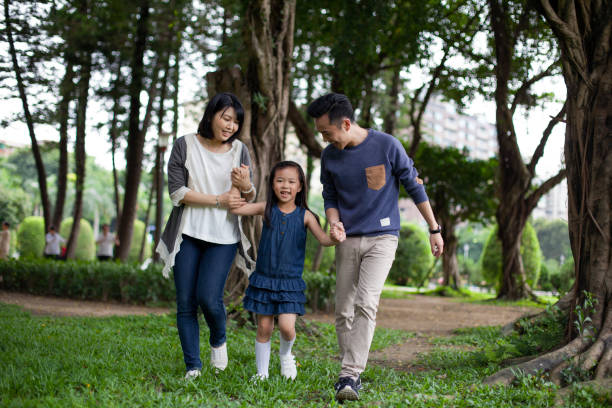 istock Asian family having a walk outdoors in summer, Taipei 1403835596