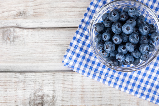 Fresh blueberries on rustic wooden table