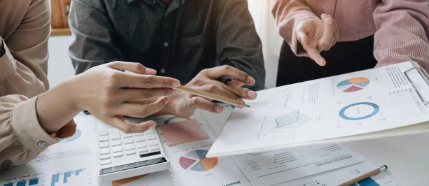 istock Business team analyzing income charts and graphs with modern laptop computer. Close up.Business analysis and strategy concept. 1403837144
