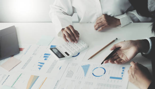 istock Two executive discussing company growth project success financial statistics, Partner meeting professional investor working start up project for both company with document, laptop and digital tablet. 1403837210