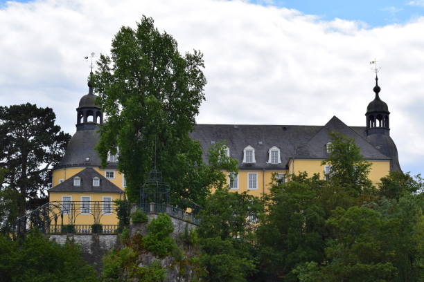 Schwarzburg, Germany - August 11, 2023: View of the Schwarzatal valley in the Thuringian Forest in summer, with the town of Schwarzburg and its castle.