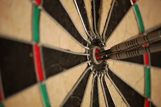 Three darts inside the center of the bullseye, also called a hattrick. On target with every shot.