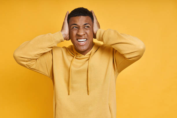 istock Frustrated mixed race man holding head in hands 1403838880