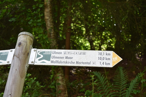 Leienkaul, Germany - 06/02/2022: hiking sign towards Ulmen and the waterfall