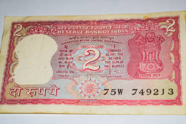 istock Old Two Rupee notes combined on the table, India money on the rotating table. Old Indian Currency notes on a rotating table, Indian Currency on the table 1403841449