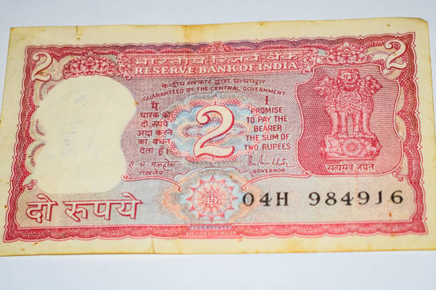 istock Old Two Rupee notes combined on the table, India money on the rotating table. Old Indian Currency notes on a rotating table, Indian Currency on the table 1403841451
