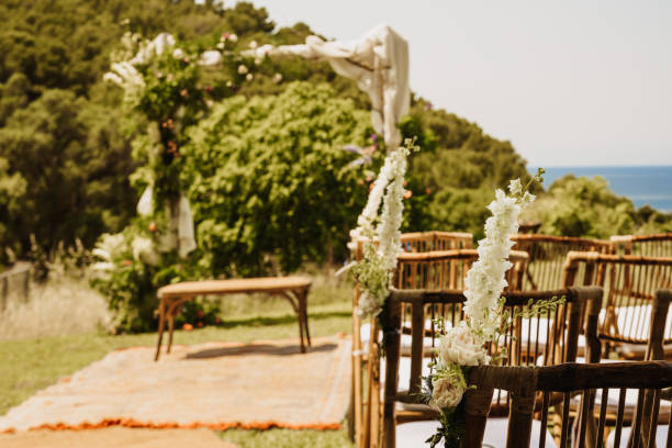 istock Beautiful boho wedding altar with a bench and boho flowers with ocean view 1403841468