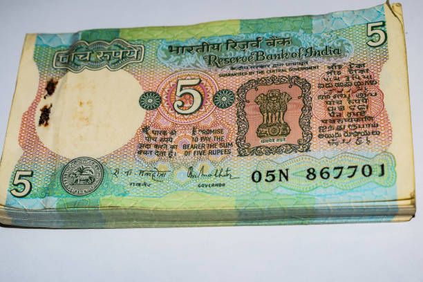 istock Old Five Rupee notes combined on the table, India money on the rotating table. Old Indian Currency notes on a rotating table, Indian Currency on the table 1403841475