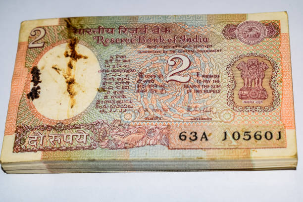 Old Two Rupee notes combined on the table, India money on the rotating table. Old Indian Currency notes on a rotating table, Indian Currency on the table