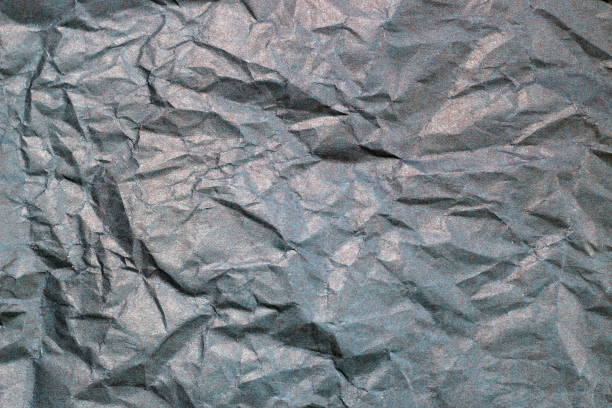 istock Texture of crumpled gray paper. 1403841509