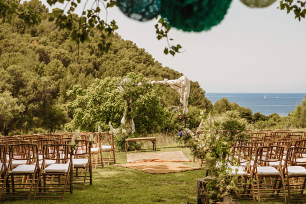 istock Boho wedding altar with a bench and chairs and boho flowers with ocean view 1403841609