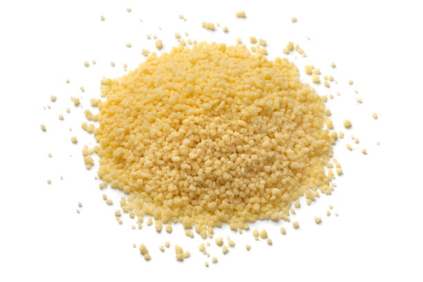 istock Heap of dried uncooked couscous on white background 1403841637