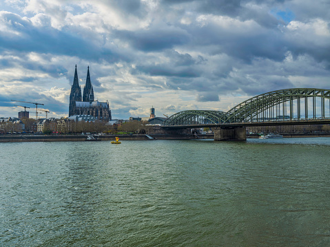 Cologne Cathedral and Hohenzollern bridge on Rhine river, Germany