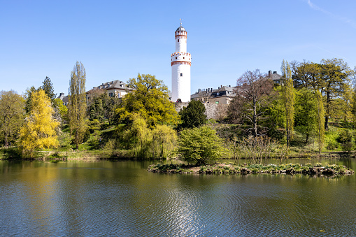 Lake Scene in Bad Homburg castle park with castle and symbolic white tower in the background, Bad Homburg, Hesse, Germany