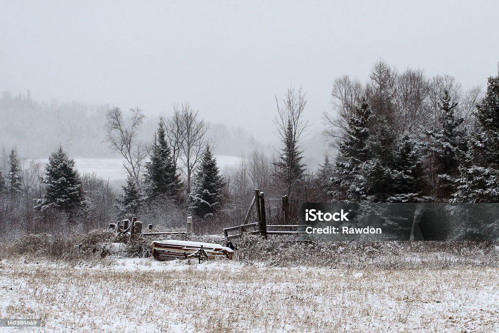 Tractor implement Tractor implement parked in field for winter Agricultural Field Stock Photo