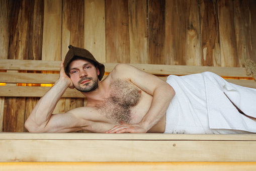 Man lying in the sauna