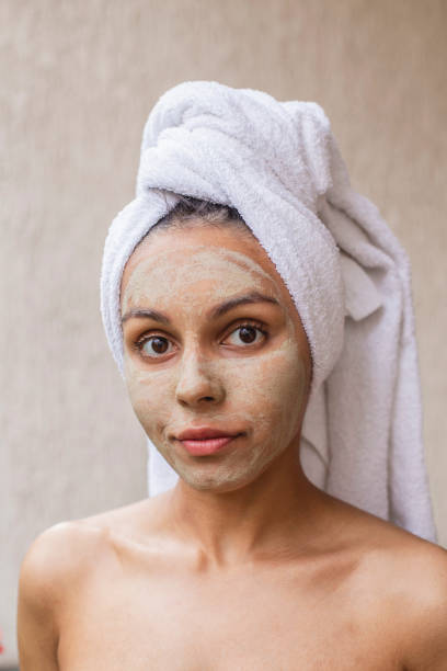 istock Happy woman with beauty mask 1403845895