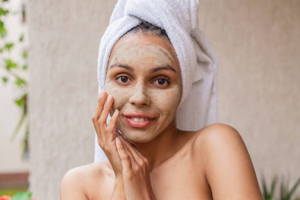 istock Happy woman with beauty mask 1403845897