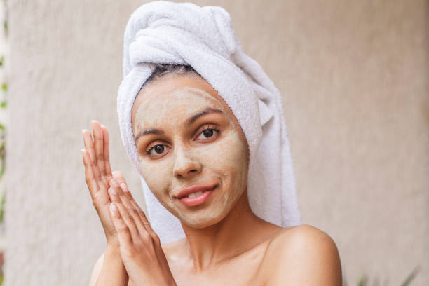 istock Happy woman with beauty mask 1403845899