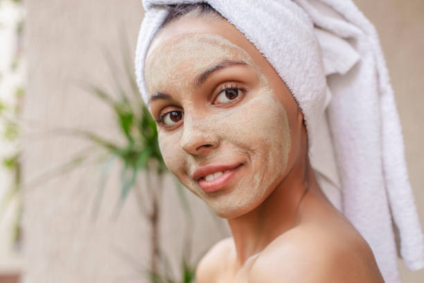 istock Happy woman with beauty mask 1403845918