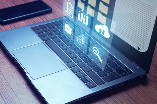 istock Businesswoman working on laptop with virtual screen. 1403846091