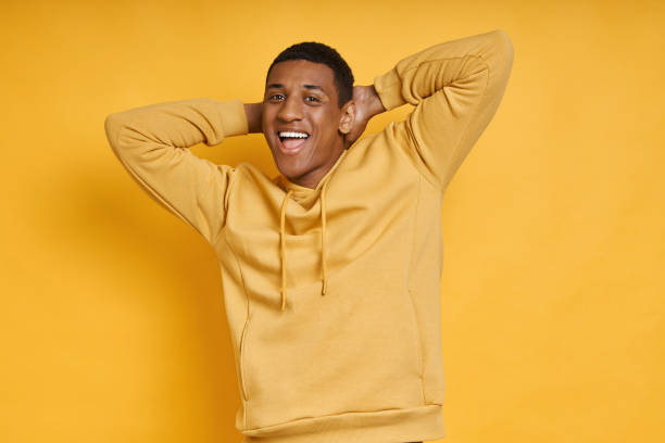 istock Relaxed mixed race man holding hands behind head 1403846694