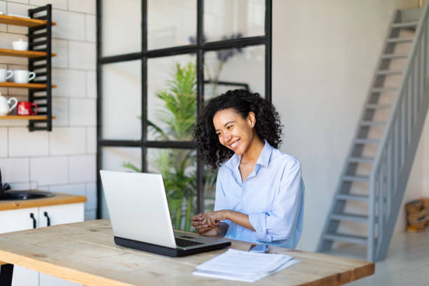 istock Young Black Woman Working From Home Using Laptop 1403846828