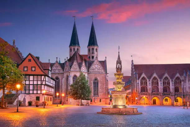 Cityscape image of historical downtown of Brunswick, Germany with St. Martini Church and Old Town Hall at summer sunset.
