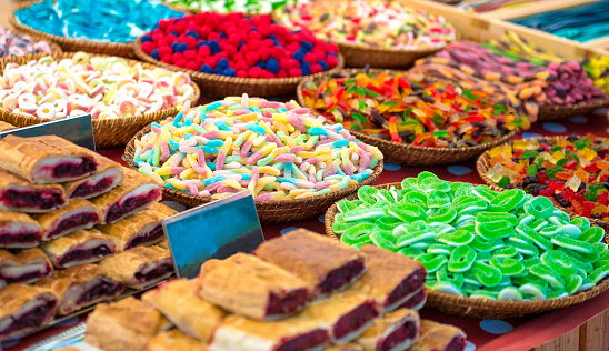 market stall with great variety of multicolored sweets and bakery