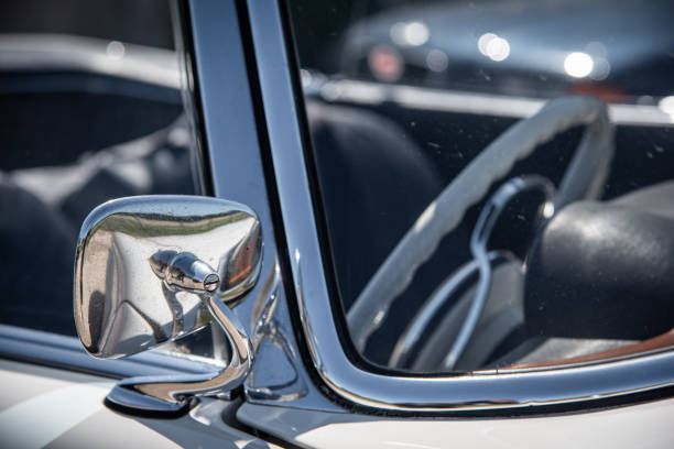 istock Chrome side mirror of a classic, vintage car. 1403848572