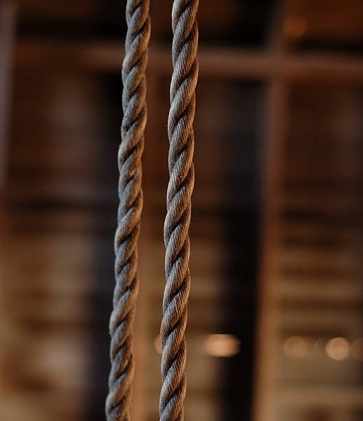 Old barn swing rope stock photo