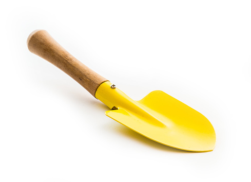 Small yellow shovel isolated on white