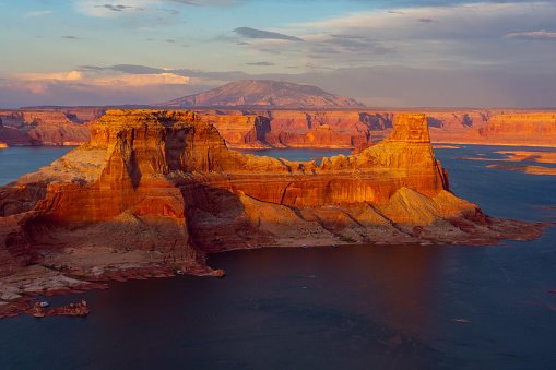 A colorful sunset on Lake Powell and Navajo Mountain in the background.