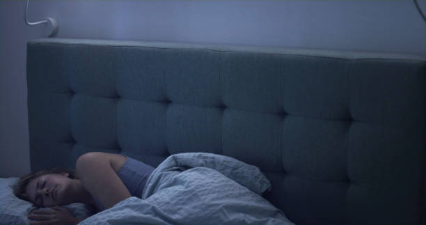 istock Woman in bed can't sleep due to insomnia 1403850291