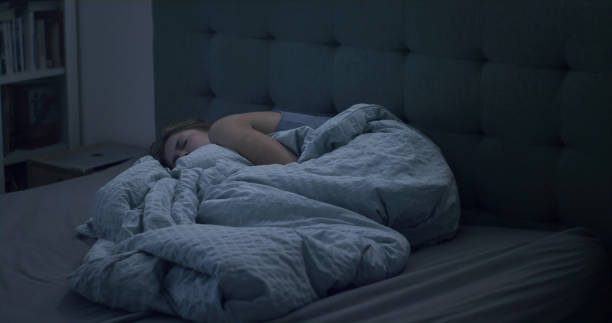 istock Woman in bed can't sleep due to insomnia 1403850297
