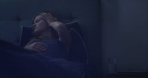 istock Woman in bed can't sleep due to insomnia 1403850324